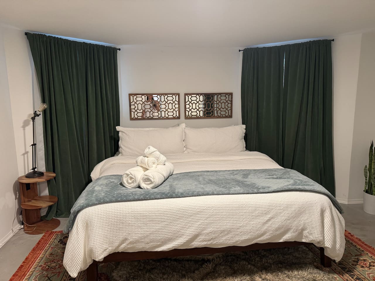 Comfortable King bedroom with plush bedding for a restful night's sleep.