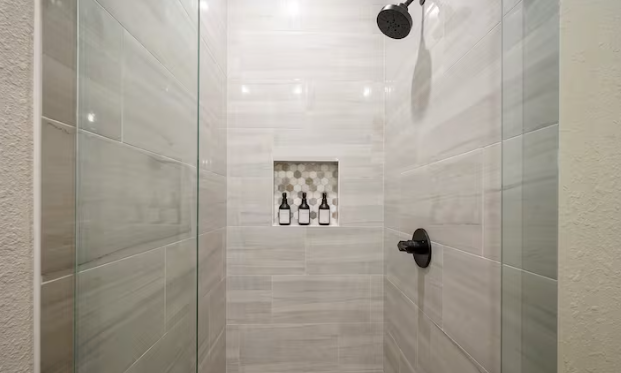 Spacious tiled shower with premium finishes