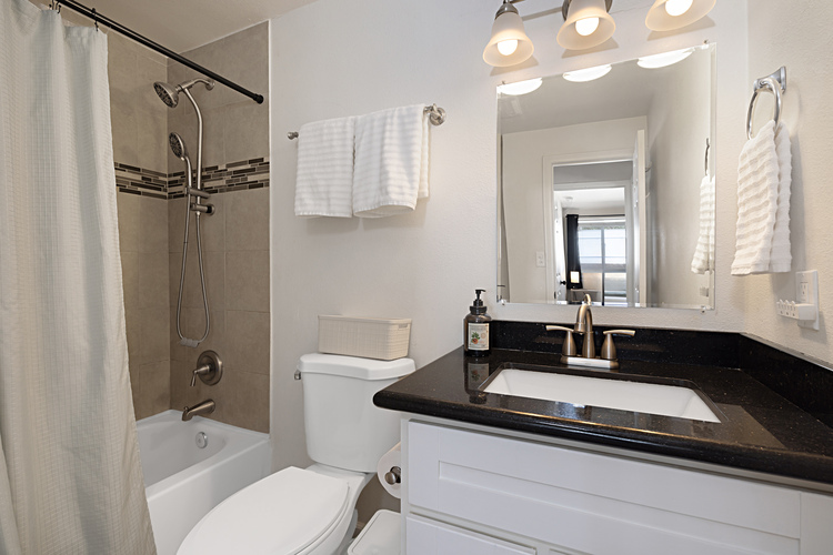 Bathroom #2 located adjacent to Bedrooms #2 and 3.  Bath tub/shower combo unit