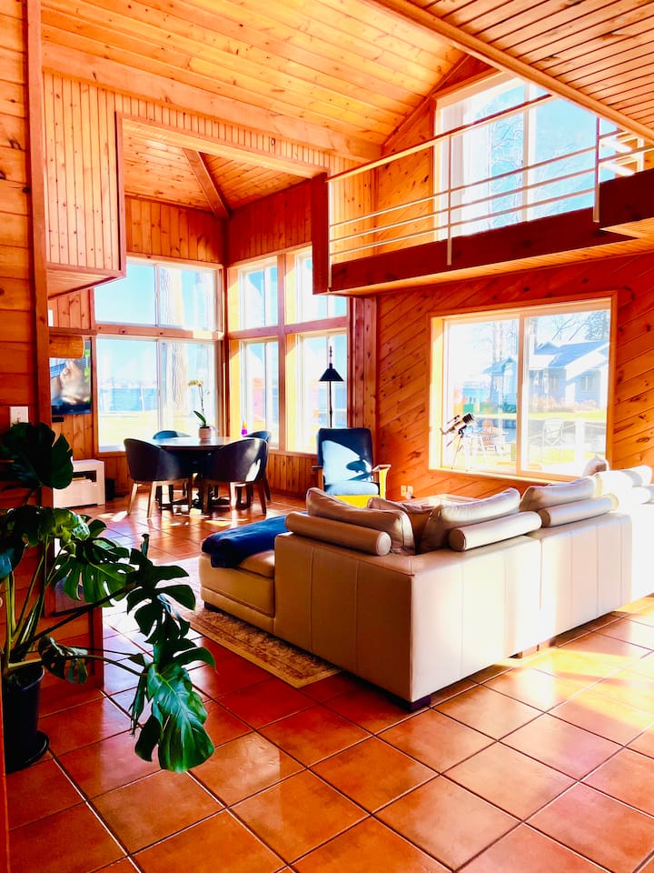 Comfortable living room with cozy seating and beautiful lake views.