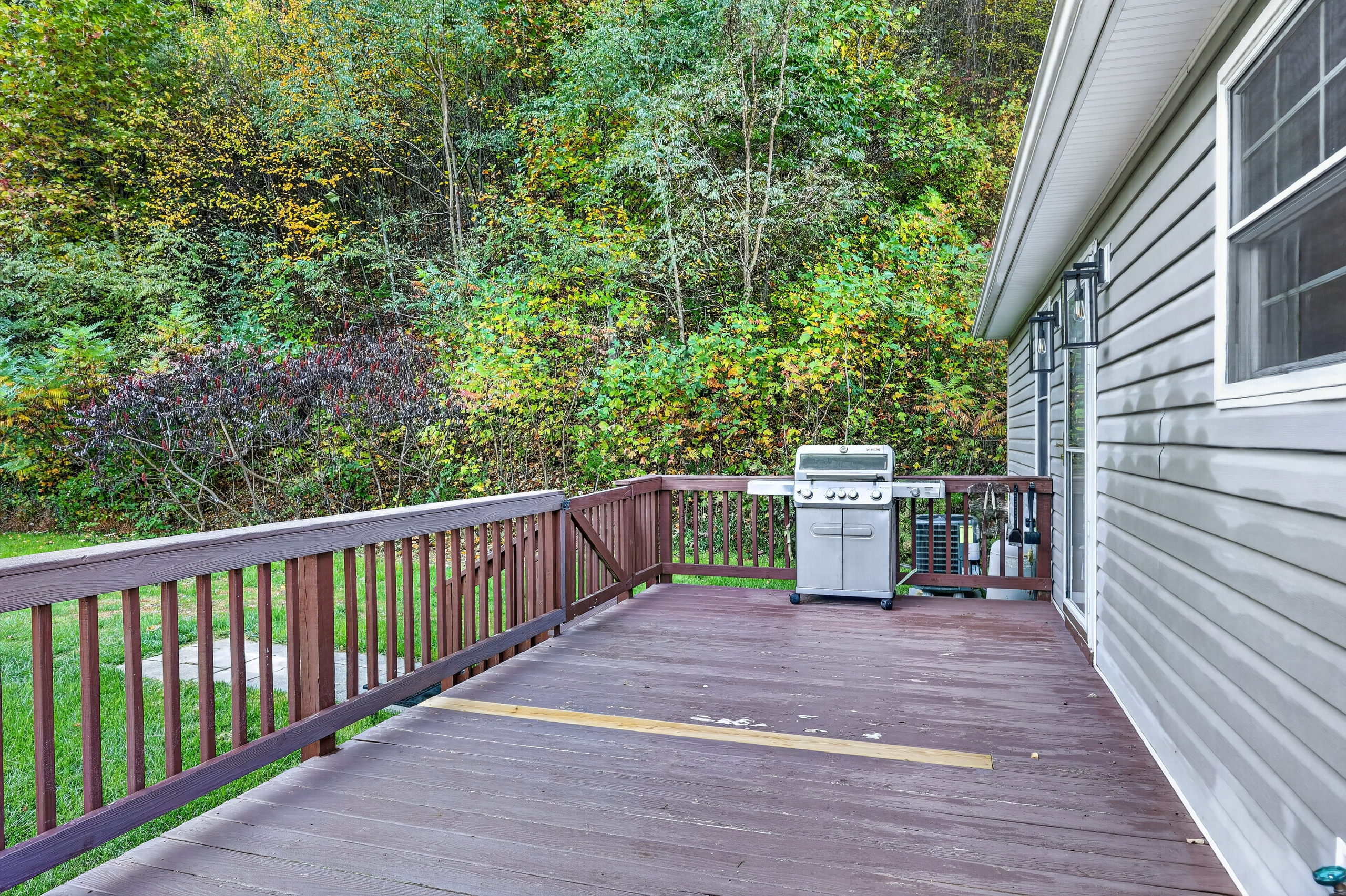 A full size propane grill is available to use that sits on the back deck between the kitchen and picnic pavilion.