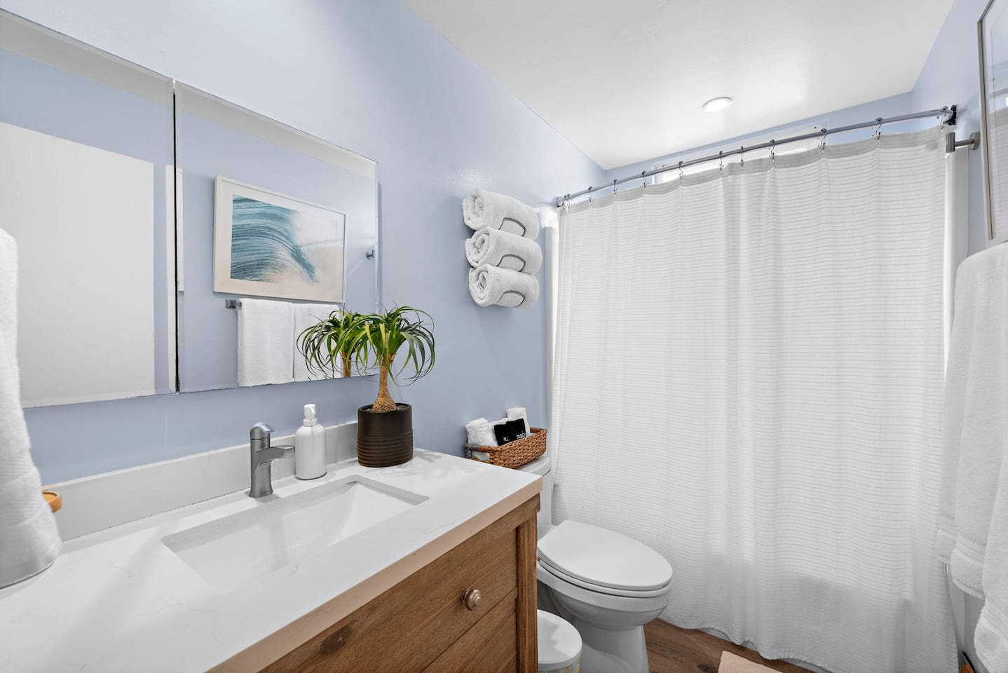 Our bright and clean hallway bathroom is fully-equipped with soap, shampoo, and conditioner.  The building has a water softener so the shower feels luxurious.  There is also an outdoor shower for use after the beach.