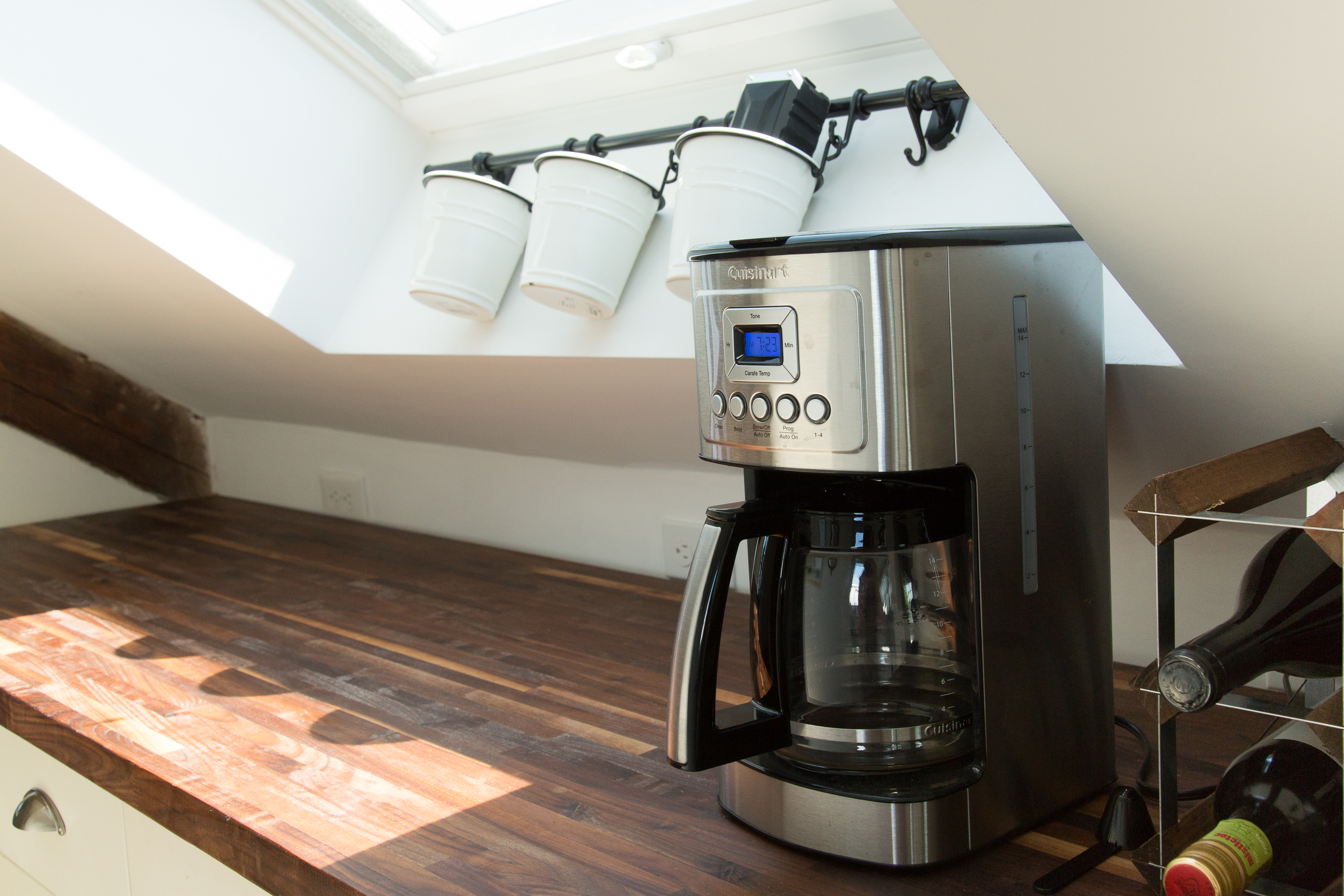 Kitchen Delight: Brew your morning coffee under sunlit skylights, perfect for culinary adventures!