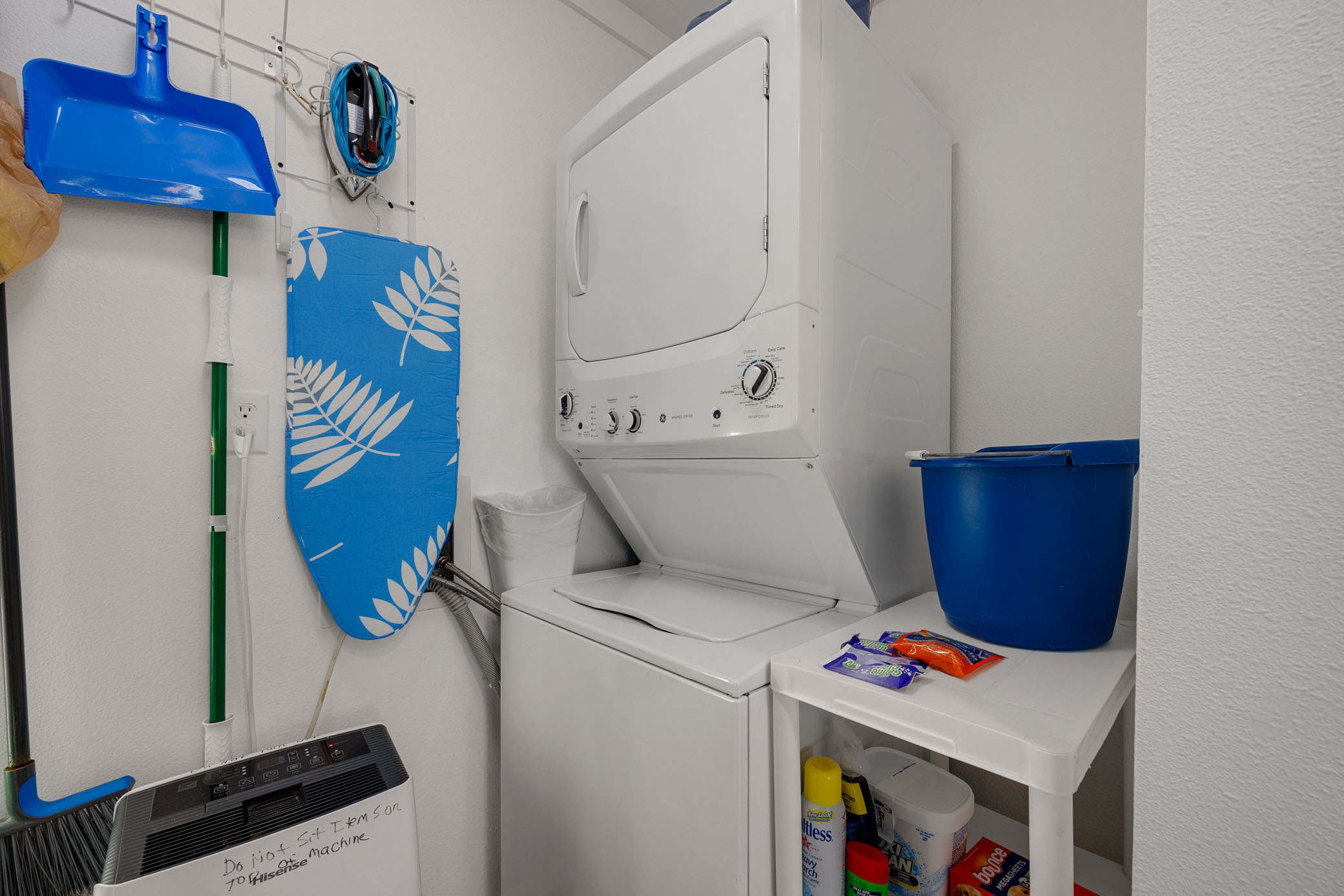 Laundry room with stacked washer/dryer