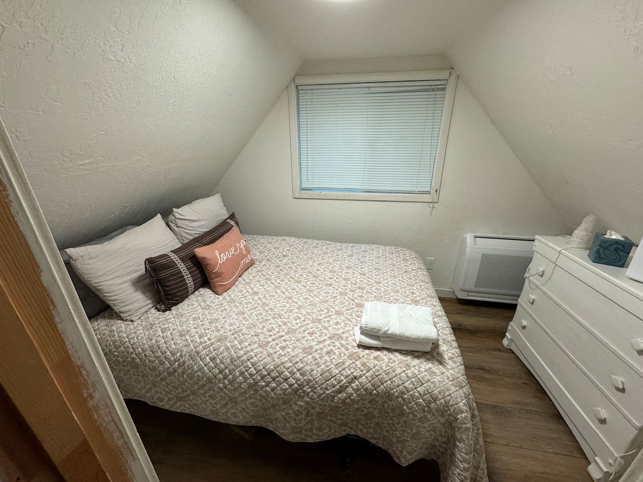 Curl up for a good night's sleep in this upstairs bedroom, featuring a snugly comforter and plenty of pillows. Drift off to sleep with the fun night light. Each bedroom has it's own thermostat with both heat and air. 
