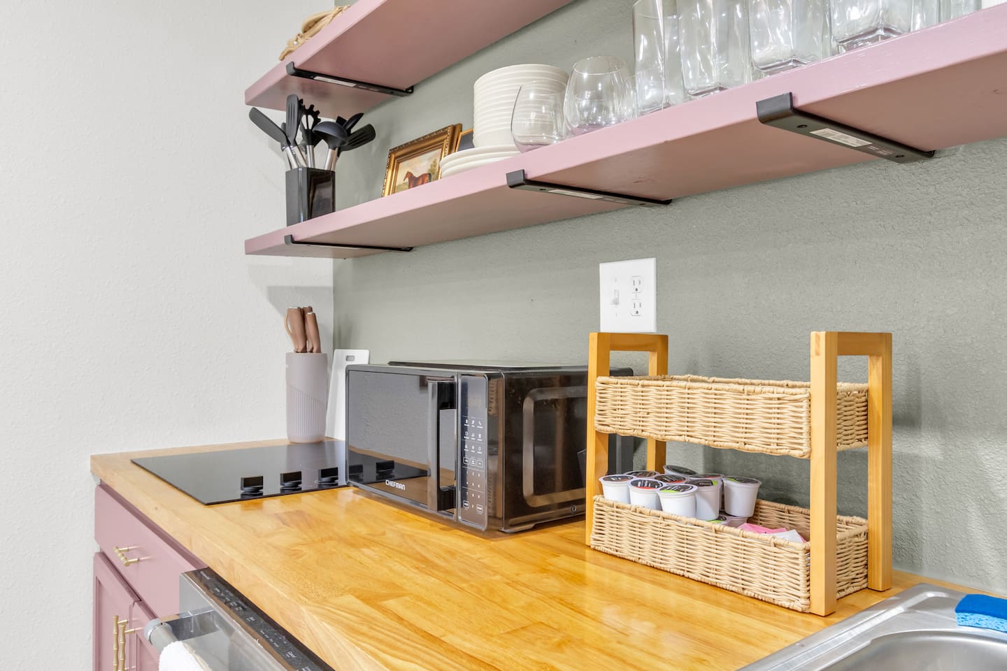 Fully stocked kitchen featuring a 4-burner electric stove, microwave, Keurig with pods, and all the cookware and glassware you’ll need.