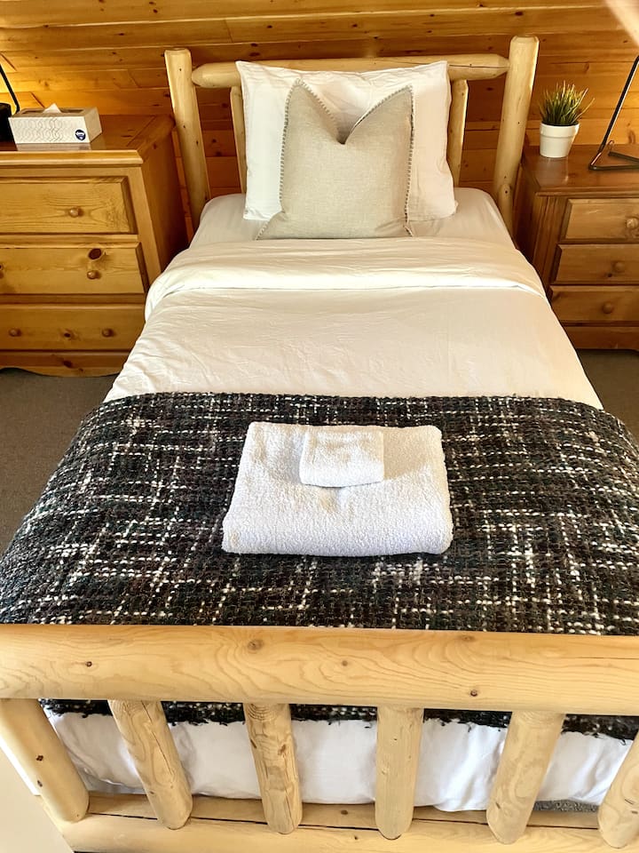 In addition to the queen bed there are two additional twin beds in the top floor bedroom. 