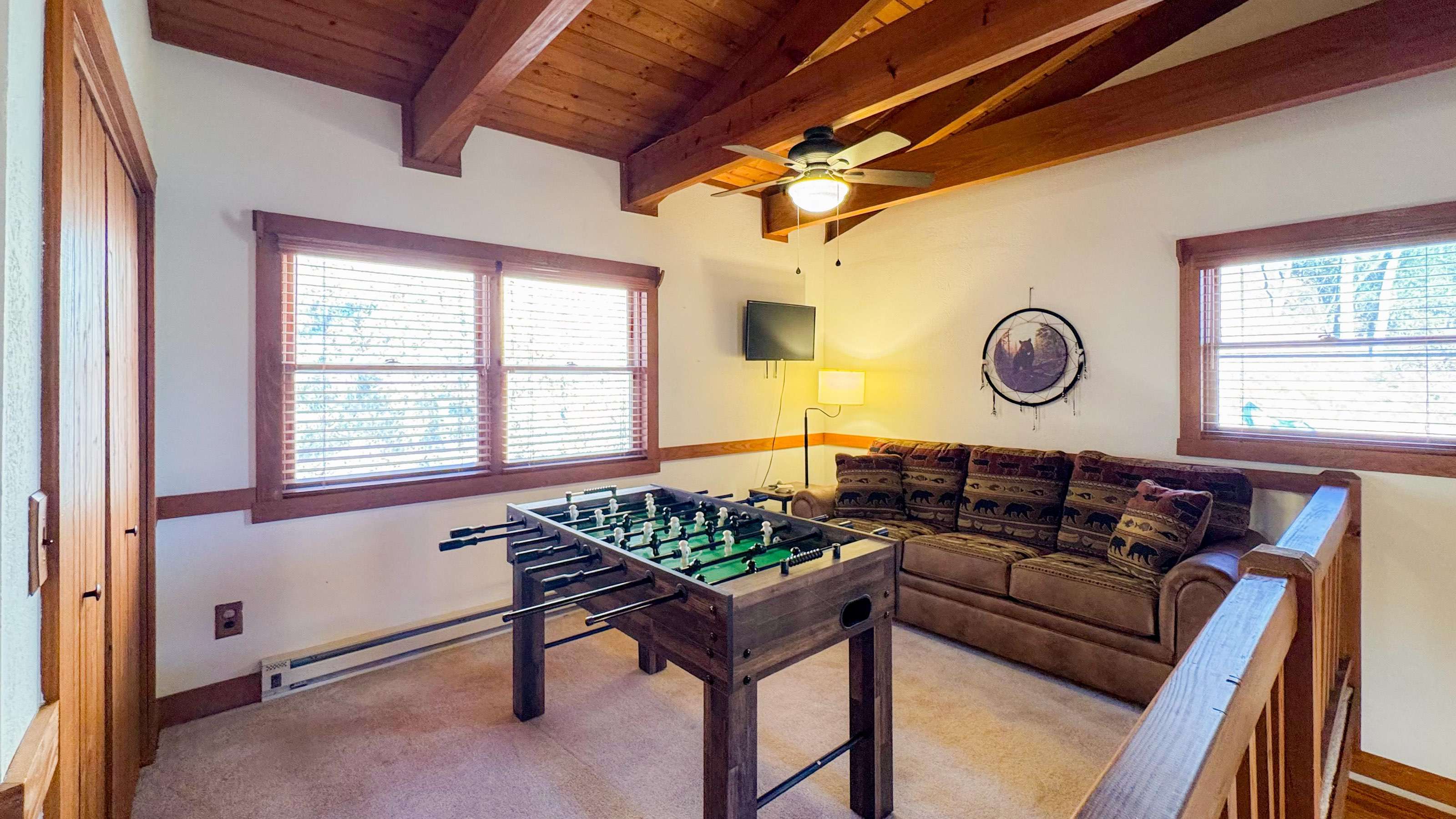 foosball and couch in the game room 