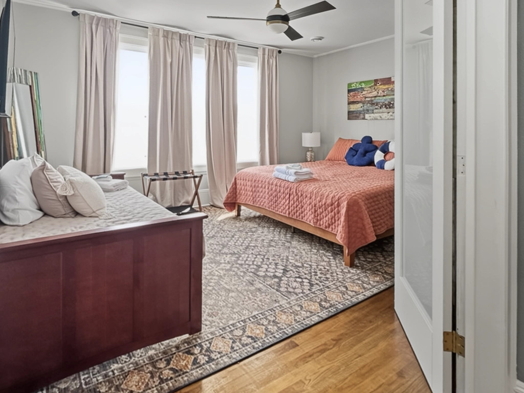 Frosted French doors open to the main bedroom