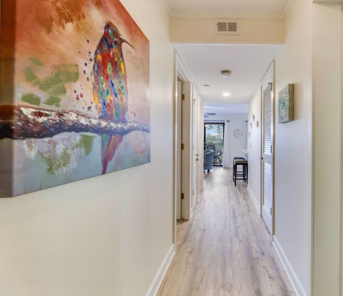 Hallway with coastal artwork