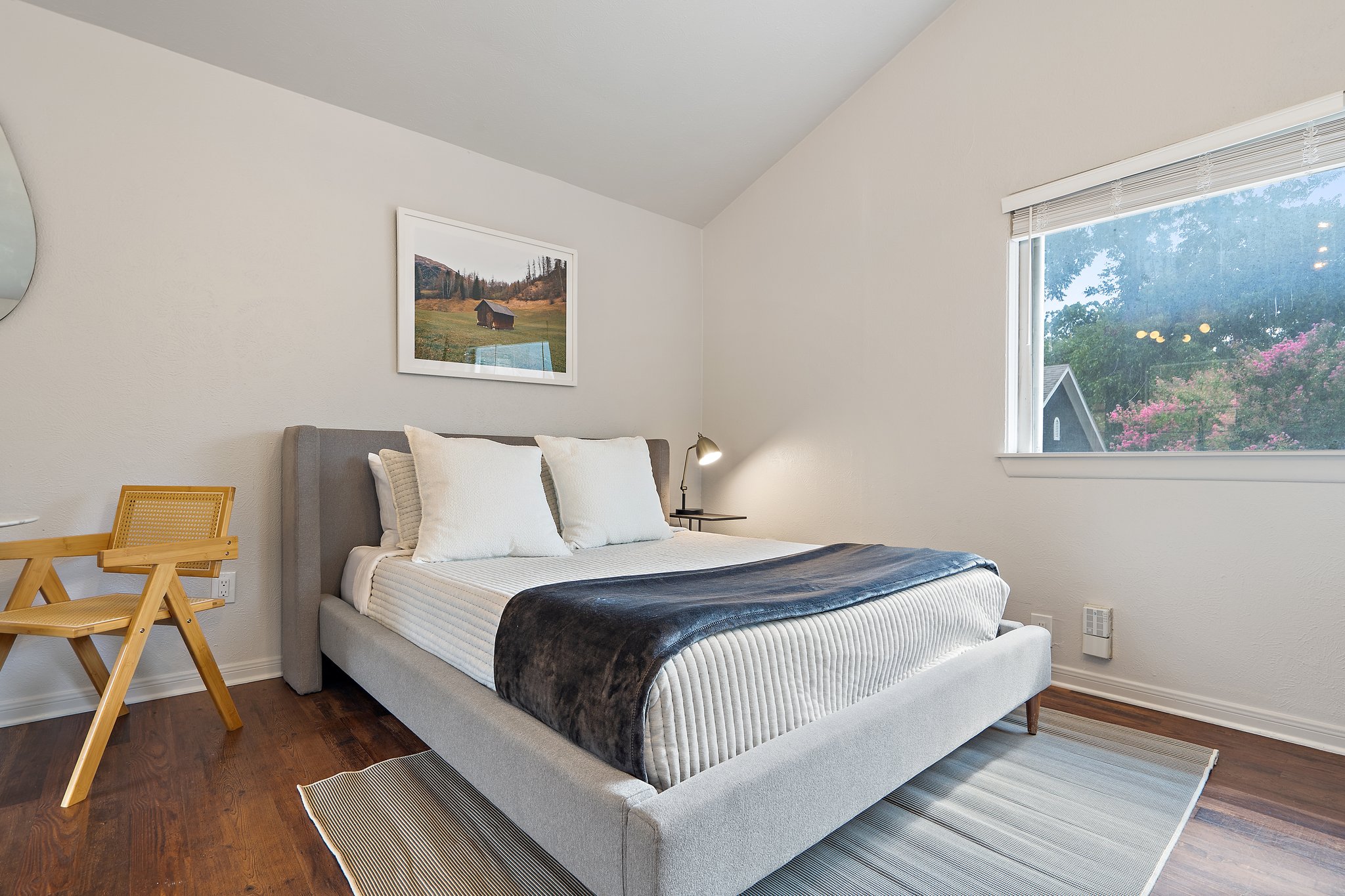 Detached Studio Queen Bed with hotel-style linens, extra pillows and blankets, room-darkening shades, and clothing storage. Ensuite bathroom and fully equipped kitchen. Sleeps up to 4 guests.