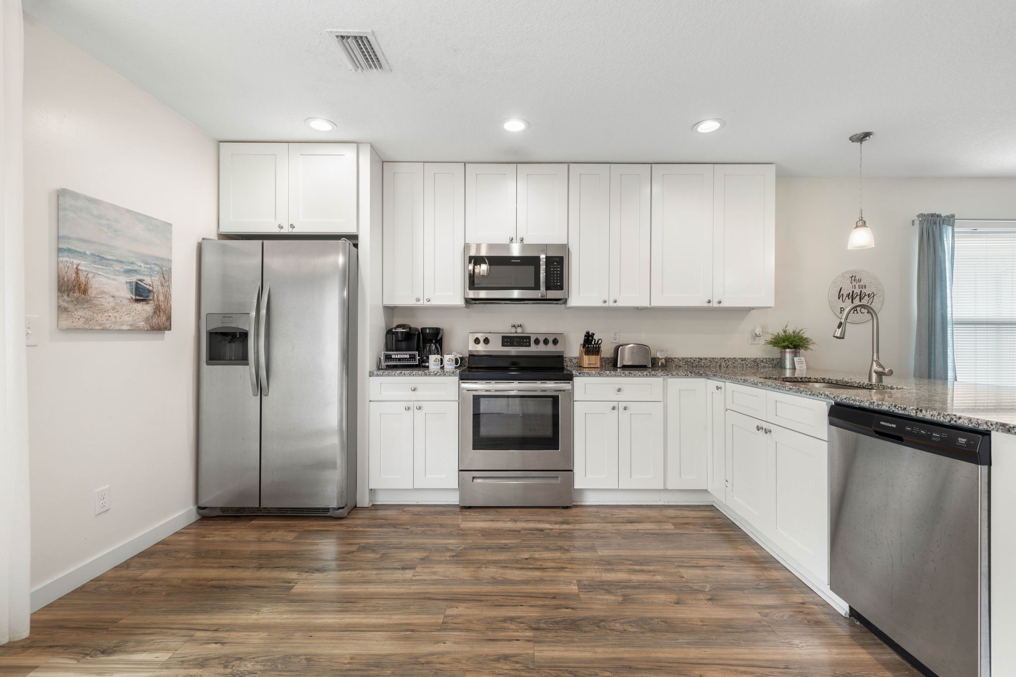 Start the morning with coffee brewing and beach plans on the counter, come back hungry for lunch by the pool, and end the night cooking together in this bright coastal kitchen made for easy, memory-filled vacations.