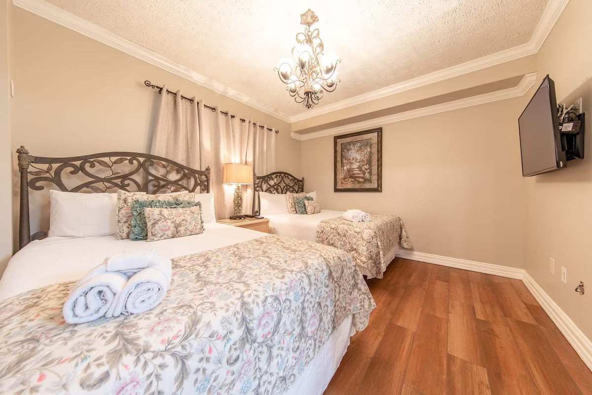Twin Queen Bedroom Ensuite With Smart TV and Private Bath from the Remainder of the Condo