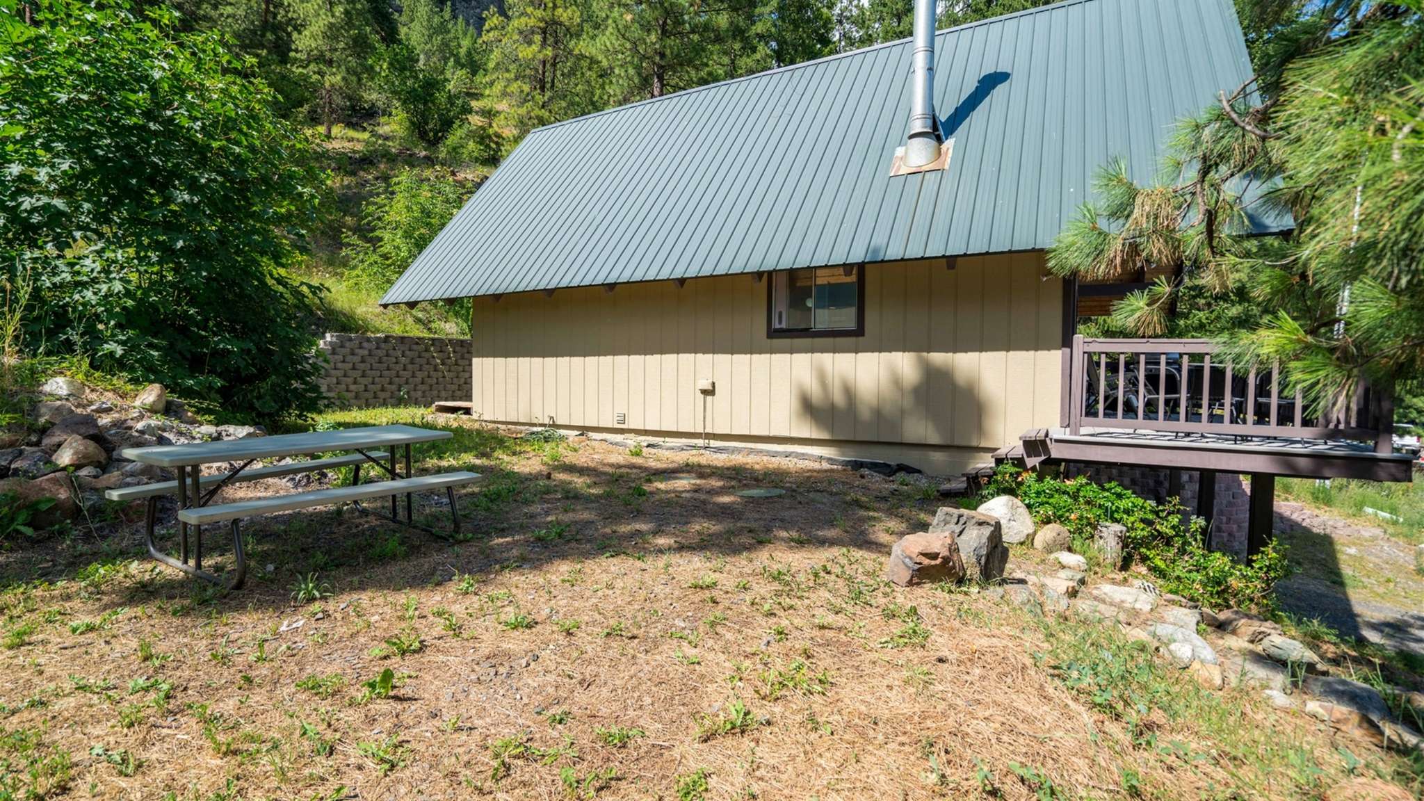 Picnic table outside for dining under the pines.