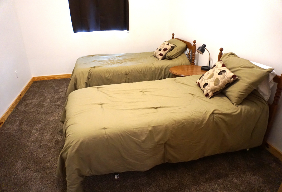 Bedroom 2: Two twin beds. 