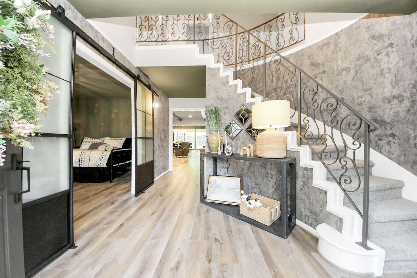 Gorgeous entrance with new flooring, fresh paint and curved staircase entrance.
