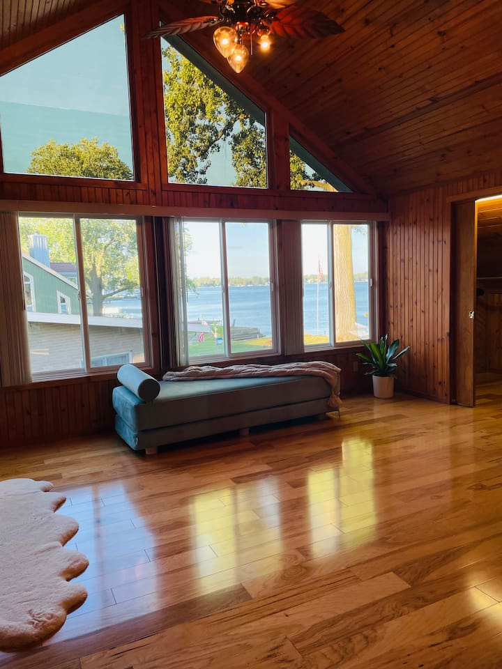 bedroom with panoramic views — the perfect place for morning coffee.