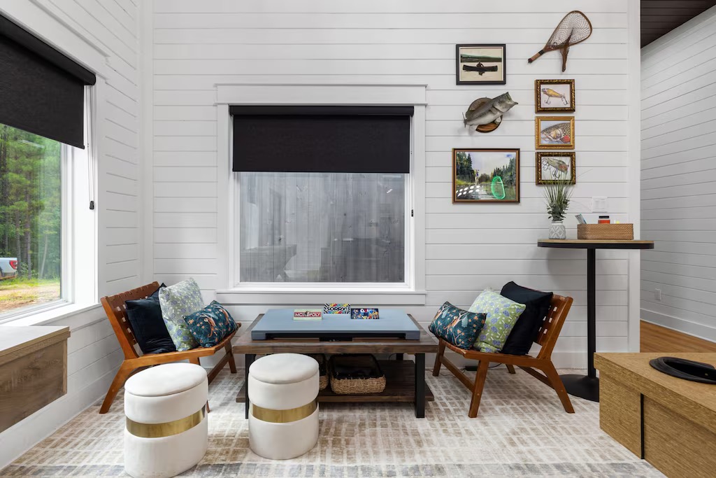 Living Room: Relax in style with bright natural light and playful decor perfect for game nights!