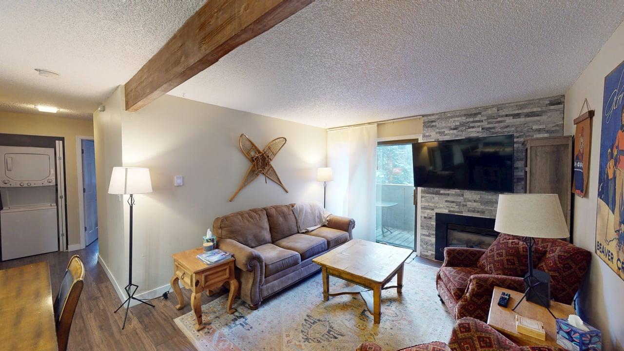 The family room includes a comfortable sleeper sofa, providing extra sleeping space for additional guests.