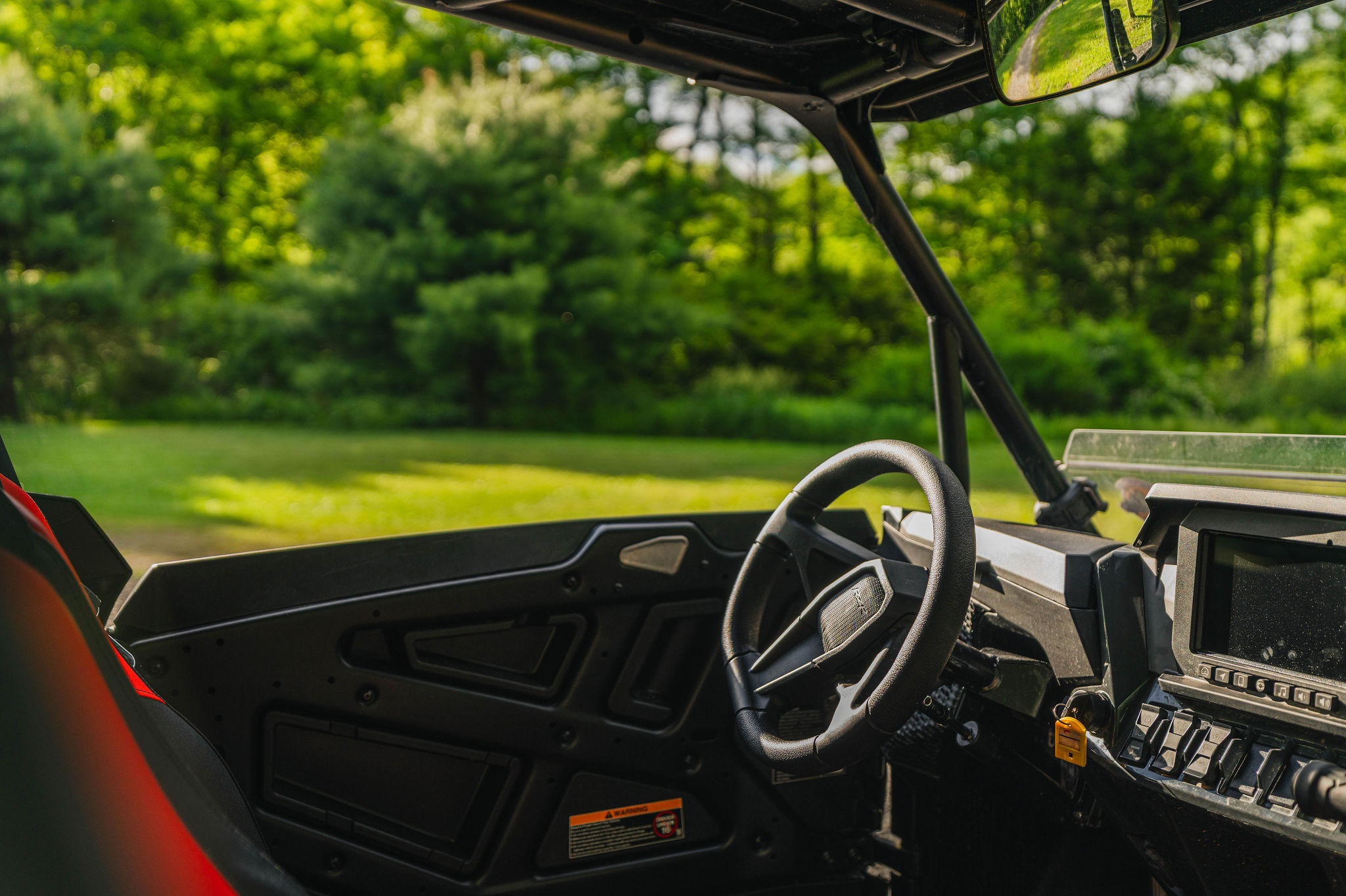 🚙 Driver's-seat view — open road, open weekend. *(UTV not included; rentals from Denton Go.)*