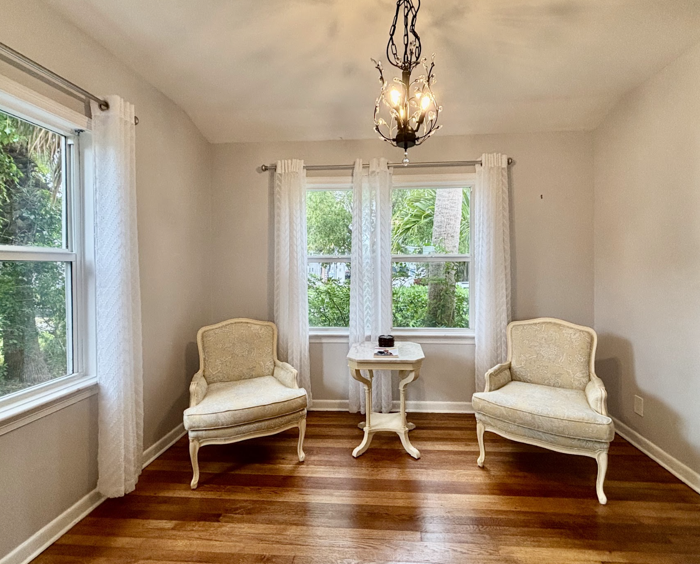 The sitting area off the main kitchen is cozy and well-lit, a wonderful little nook to relax in.