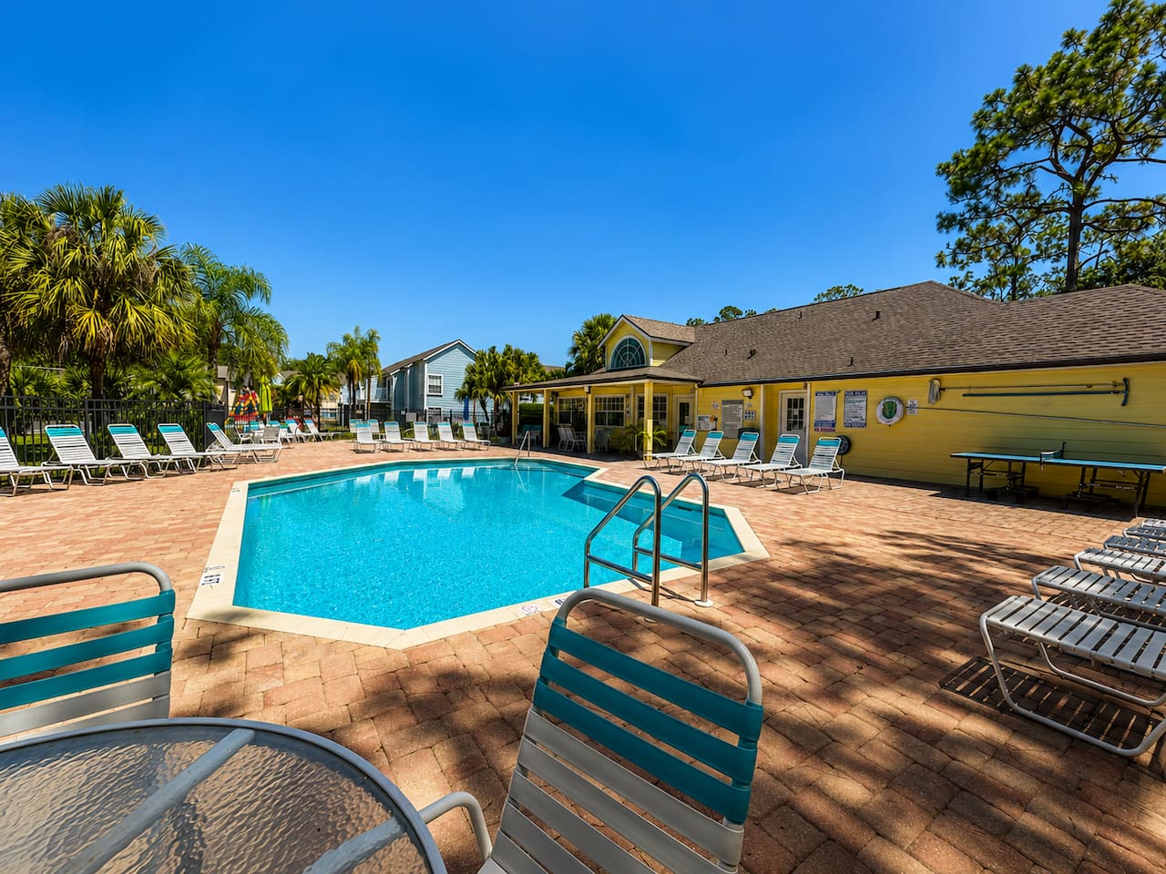 Resort-style community pool with plenty of lounge seating.