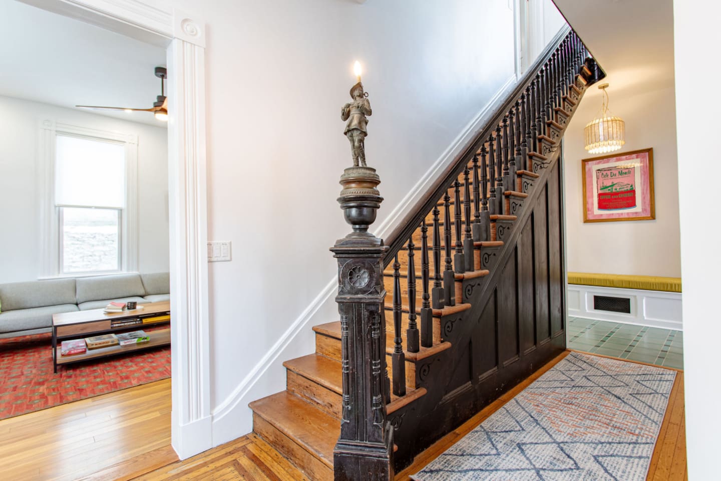 Stairs leading upstairs with a clear view of the spacious living area below, creating a sense of openness and connection between the two levels.
