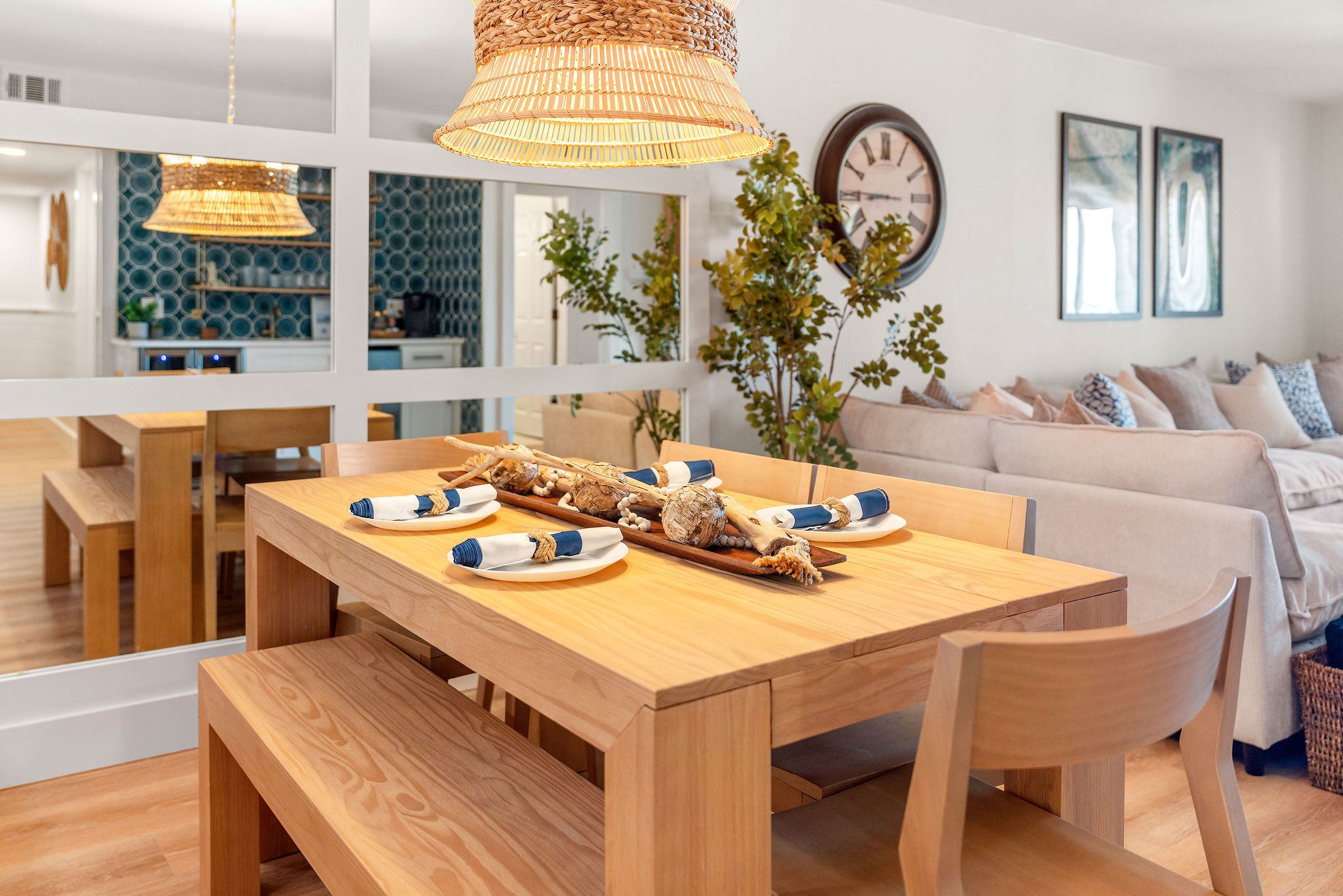 Enjoy breakfast under the warm glow of the woven chandelier. The tropical artwork adds a relaxing touch to your morning routine.