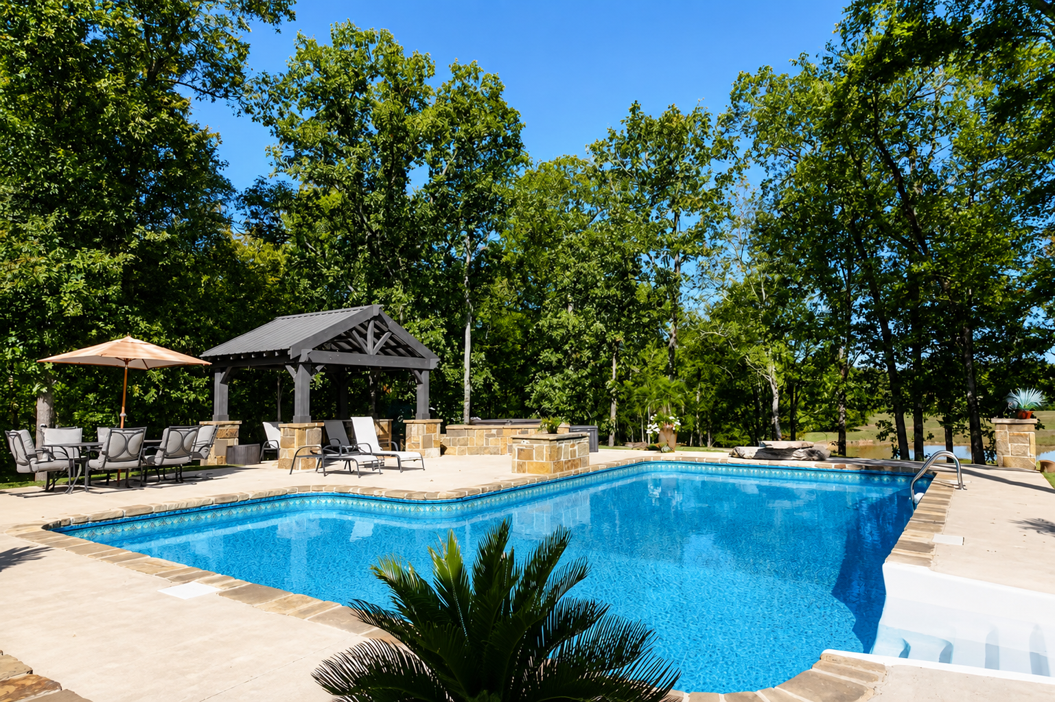 The pool area has a covered patio, hot tub, and a fire pit for all your outdoor fun.