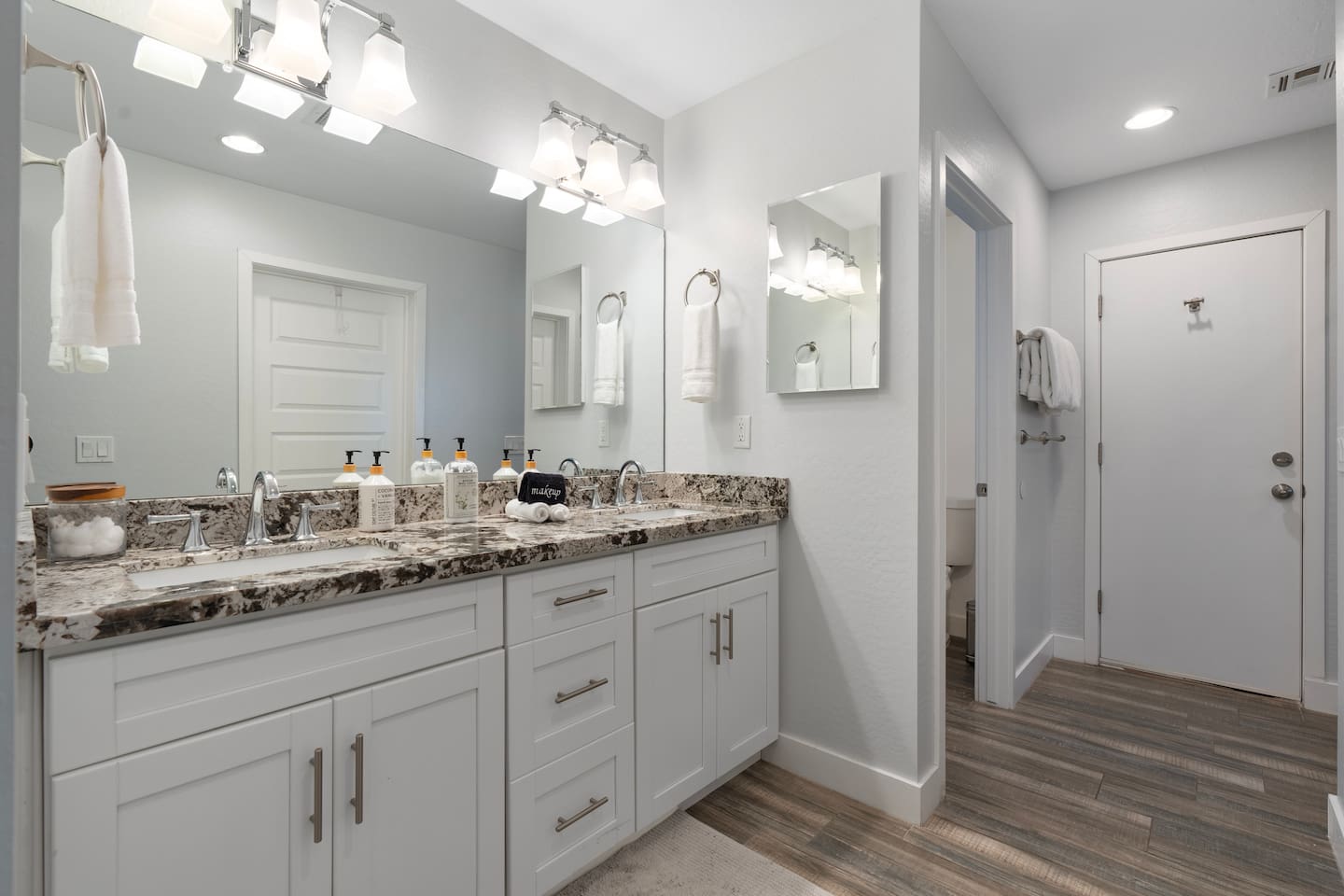 Spacious bathroom featuring a large sink, providing ample counter space for convenience and organization.