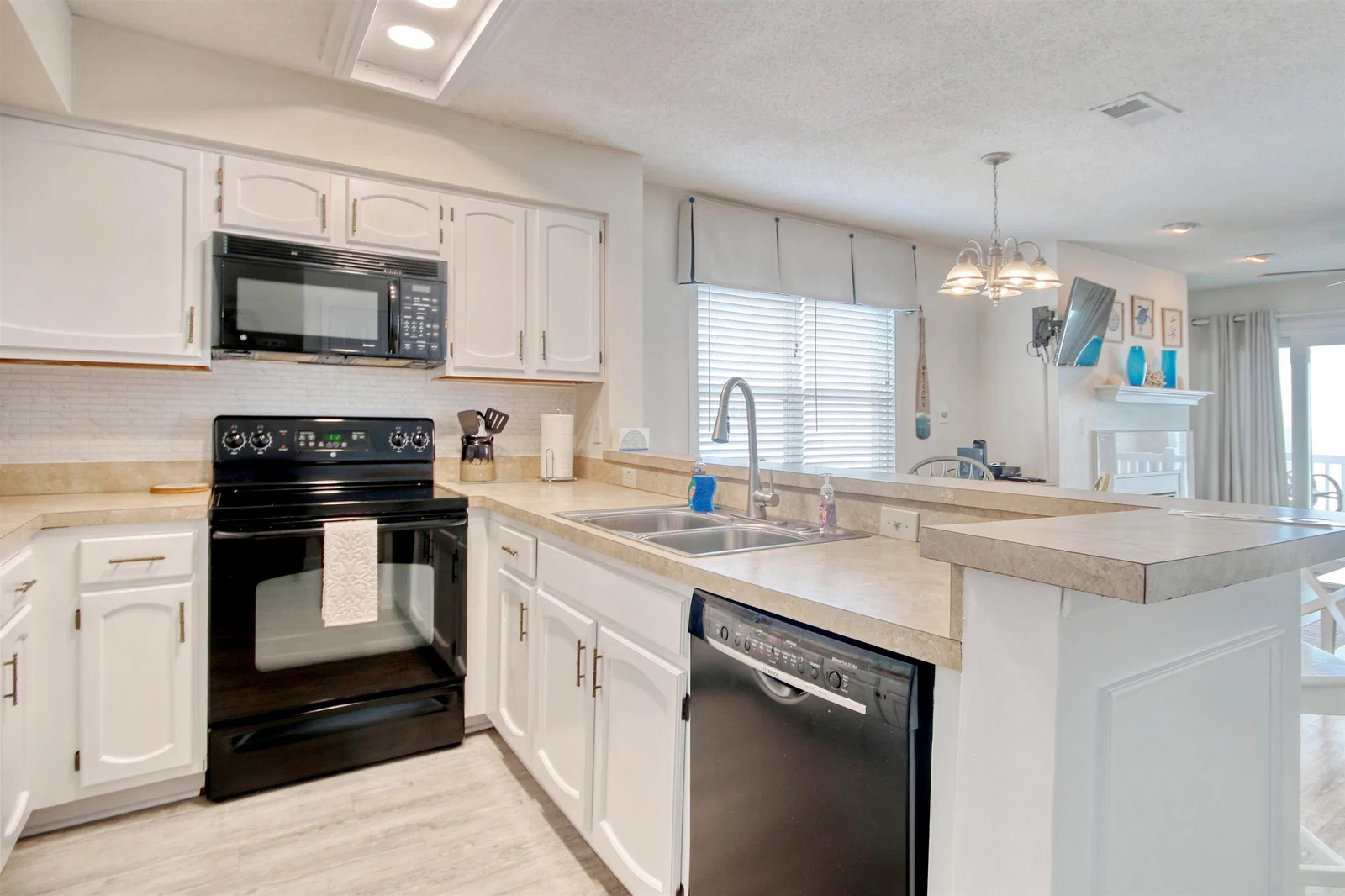 Kitchen with range, microwave and dishwasher