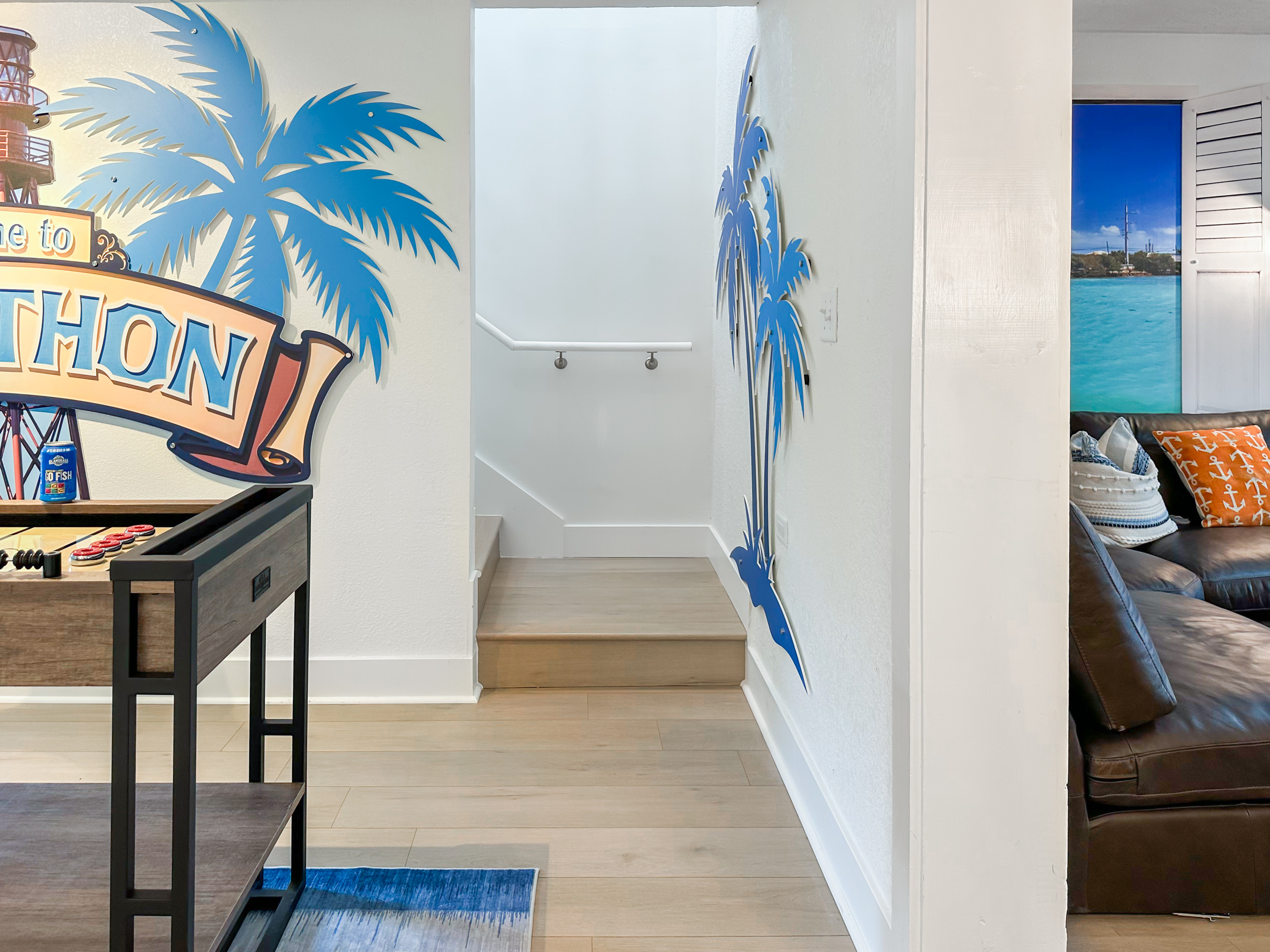 Upstairs access is between the game room and the living room.