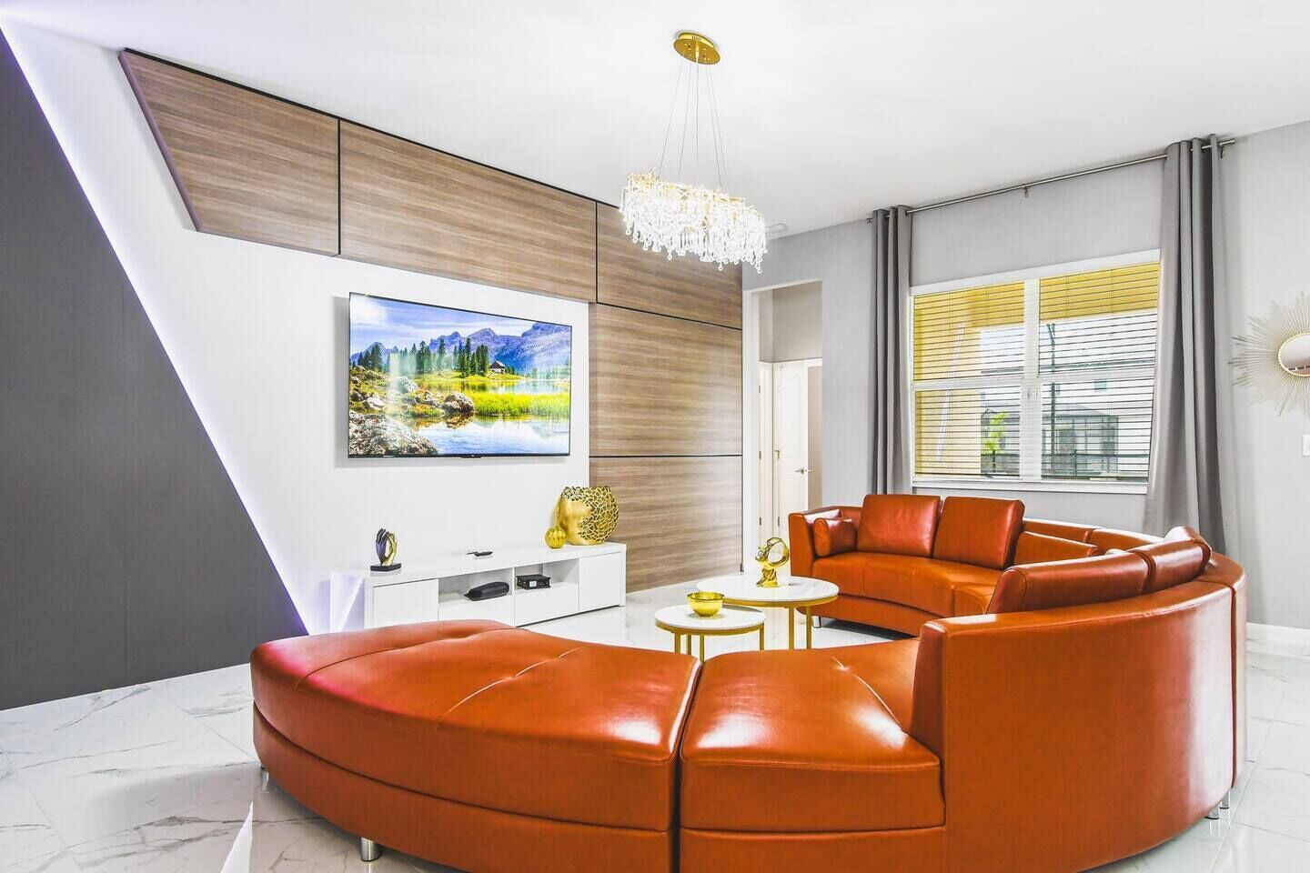 Gather and relax in this spacious living room, featuring a large TV for the perfect entertainment experience.