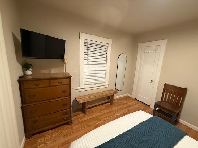 Full bedroom main floor with full length mirror and roku Tv and dresser for your use