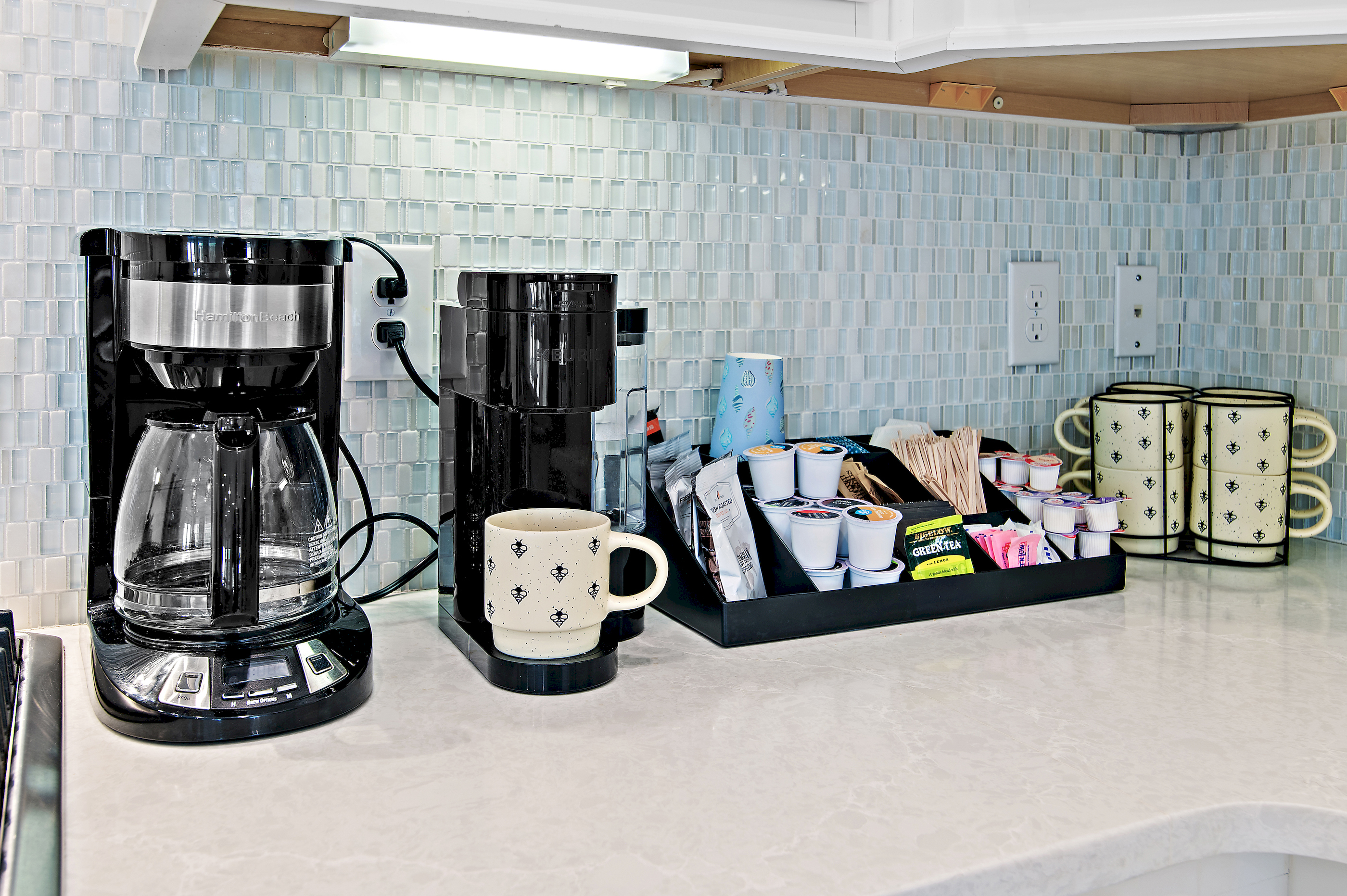 Our first-class coffee bar offers both standard pot and single-cup brewing options, fully stocked with coffee, creamer, and sugar for your convenience.