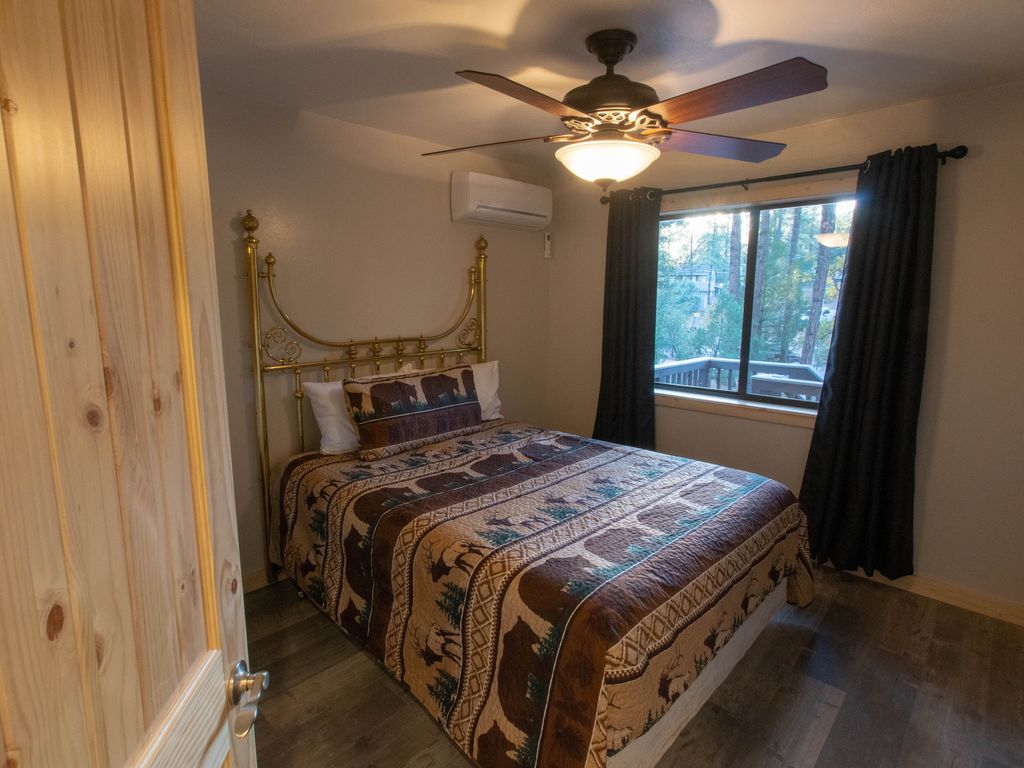 Front bedroom with Sealy queen bed on main level.  Walk in closet with extras.