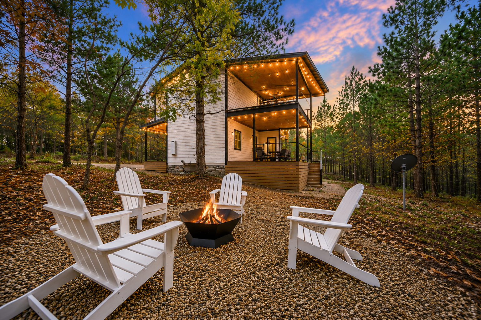 Outdoor firepit nights behind the cabin just feel different.
Tucked beneath the trees with glowing skies overhead and the cabin shining in the background, this is the kind of escape you’ll wish lasted longer.