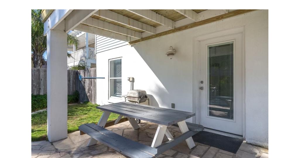 Need an escape from the sun? Lounge under the covered patio and take in the tranquil sounds of the waterfall in your private tropical backyard.