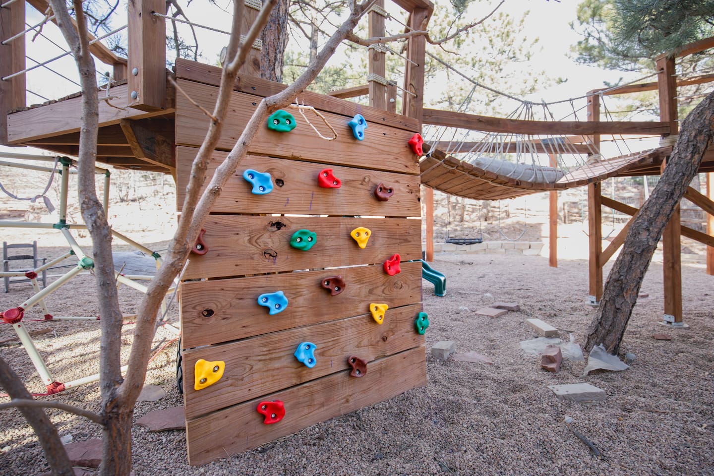 A backyard climbing wall offers a fun and safe adventure space just for kids. Featuring colorful handholds and a sturdy design, it’s perfect for outdoor play!