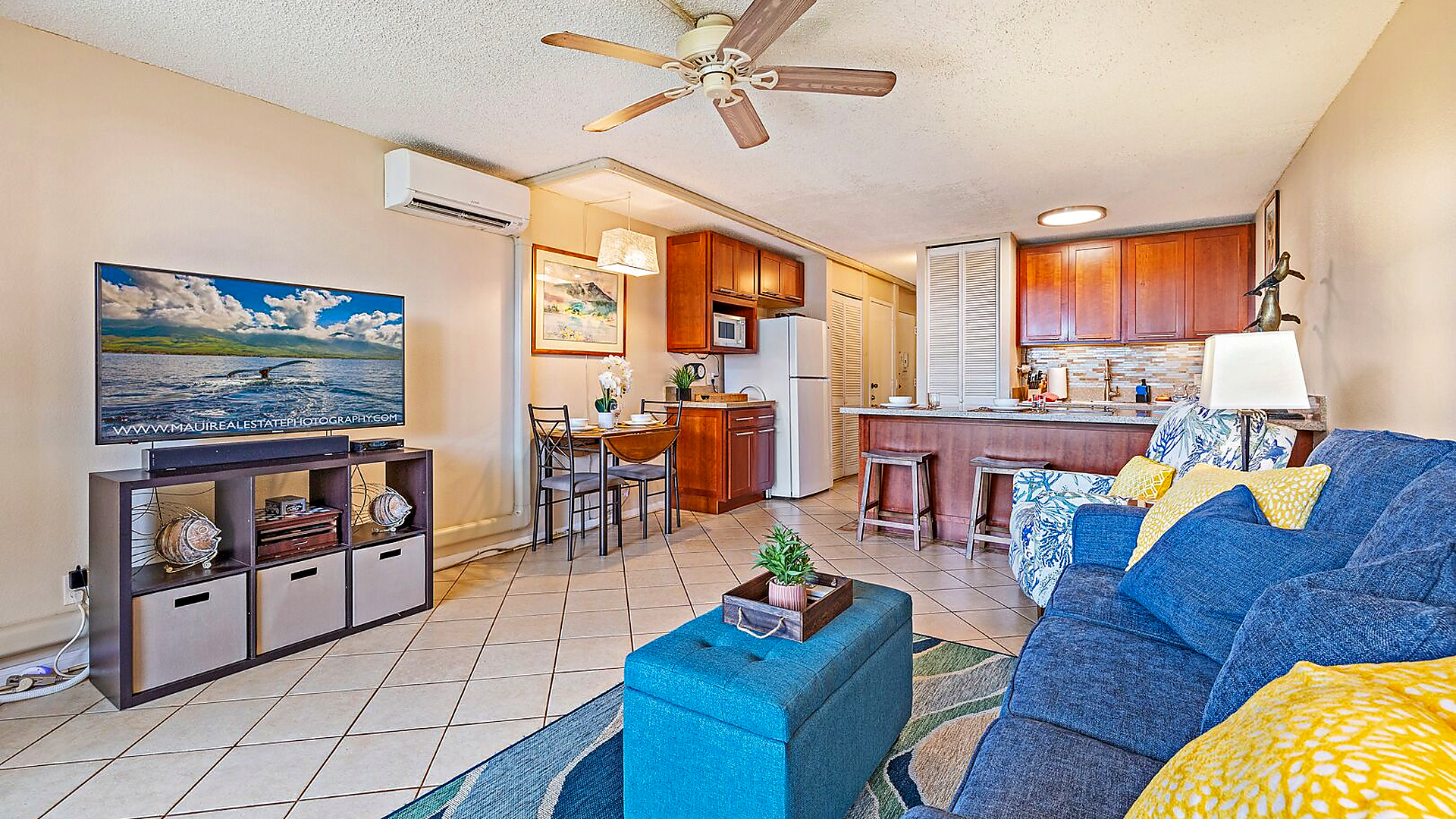 Open concept dining and living area with 50 inch smart TV.