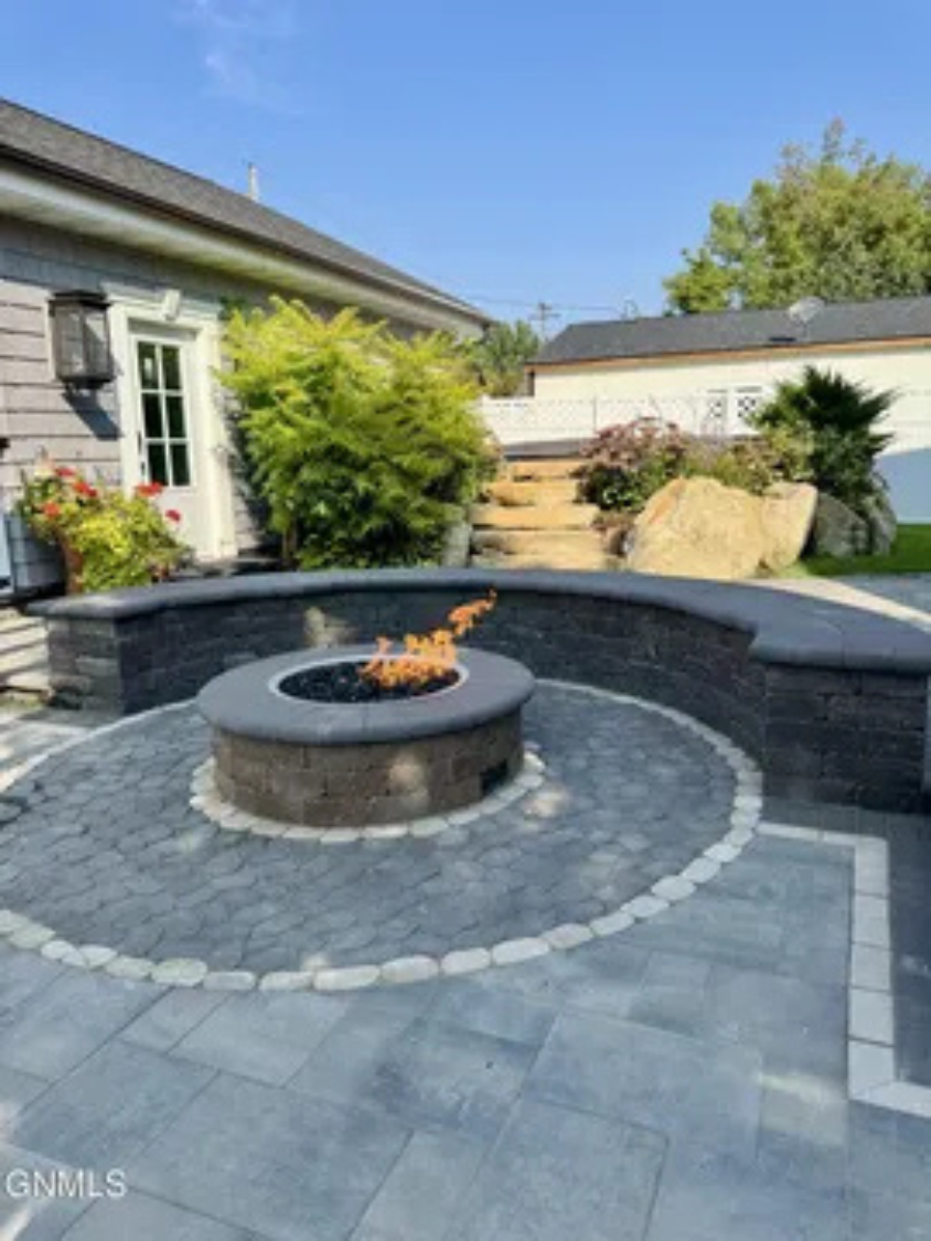 This fire pit area gives you a great spot to unwind and spend time together outdoors.