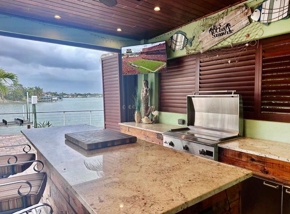 The outdoor kitchen and lanai allow outdoor entertaining regardless of weather.