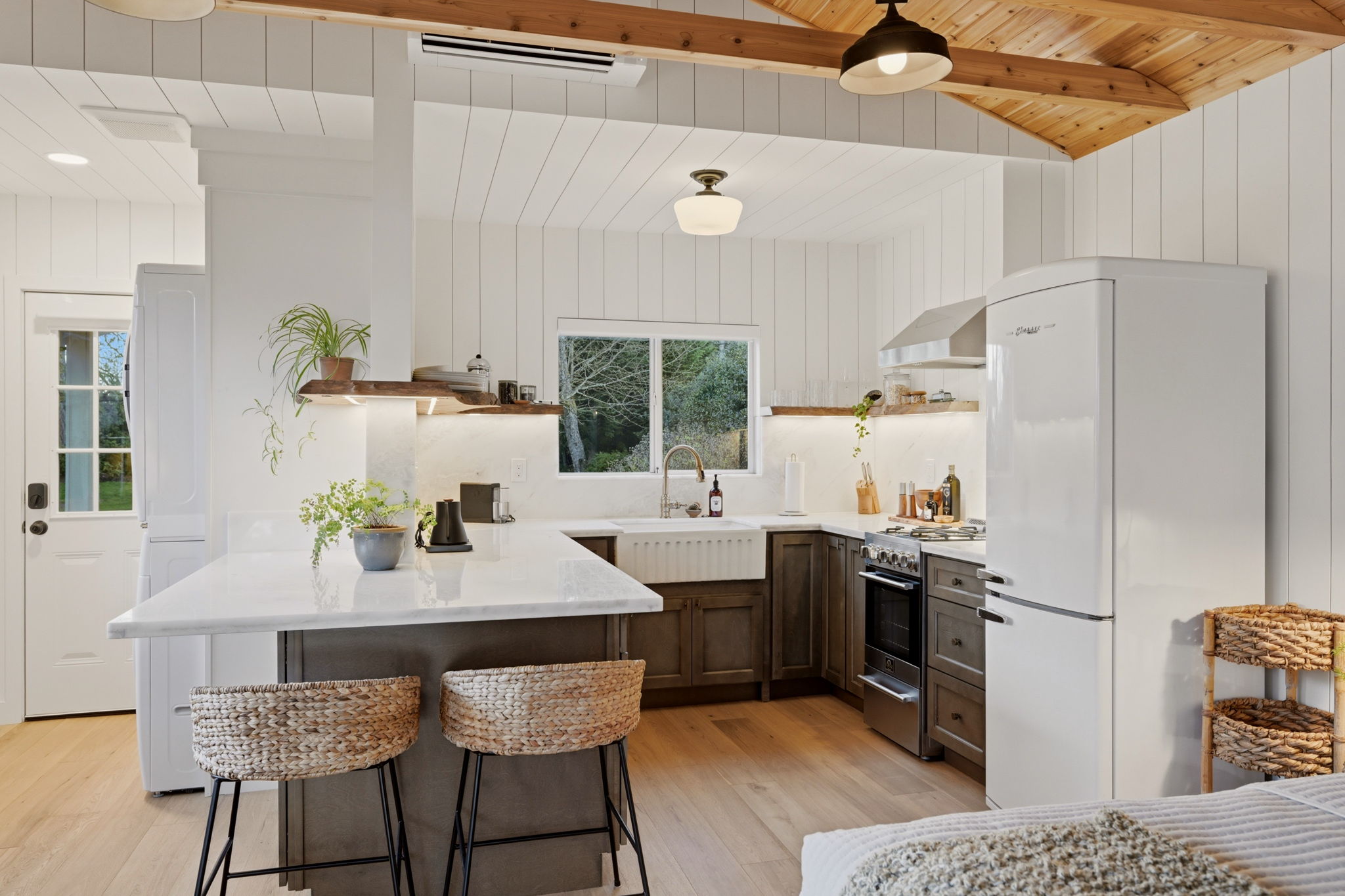 Most tiny homes ask you to compromise. Not this one. Enjoy a full gourmet kitchen with gas range, generous prep space, and everything needed for cooking at the lake. Gas stove, dishwasher, vintage styled fridge and overstocked for the foodie in you! 