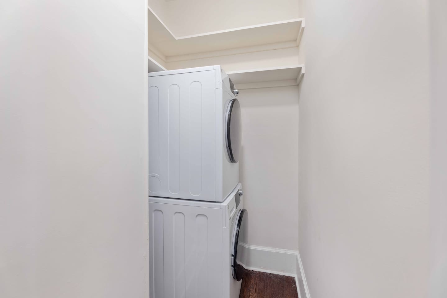 Washer/dryer unit accessible through the kitchen. 