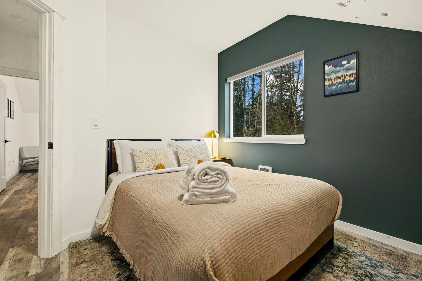 Bedroom #3 comes with a Queen -sized bed and a view of the backyard. 