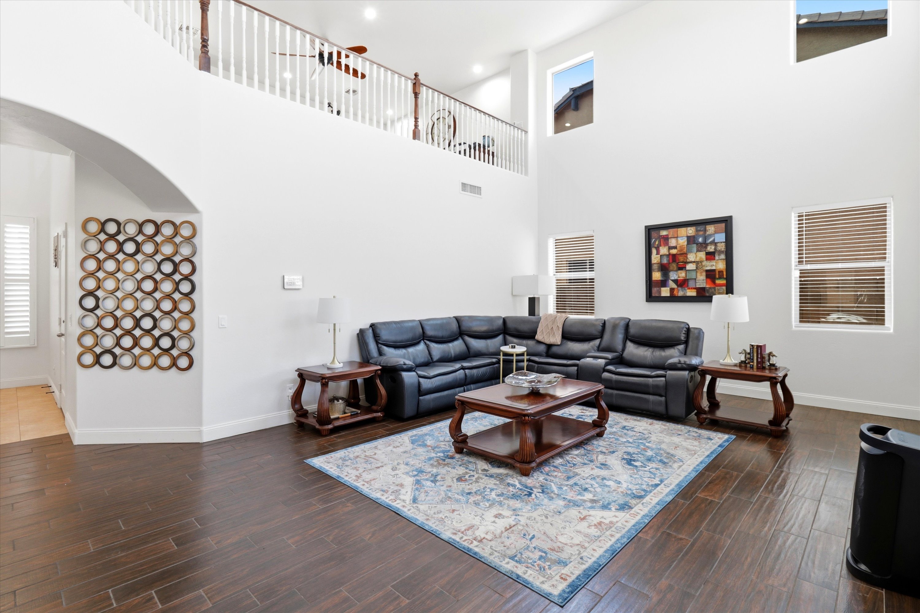 Living room with high ceilings, leather seating, and room to sit back or spend time together.
