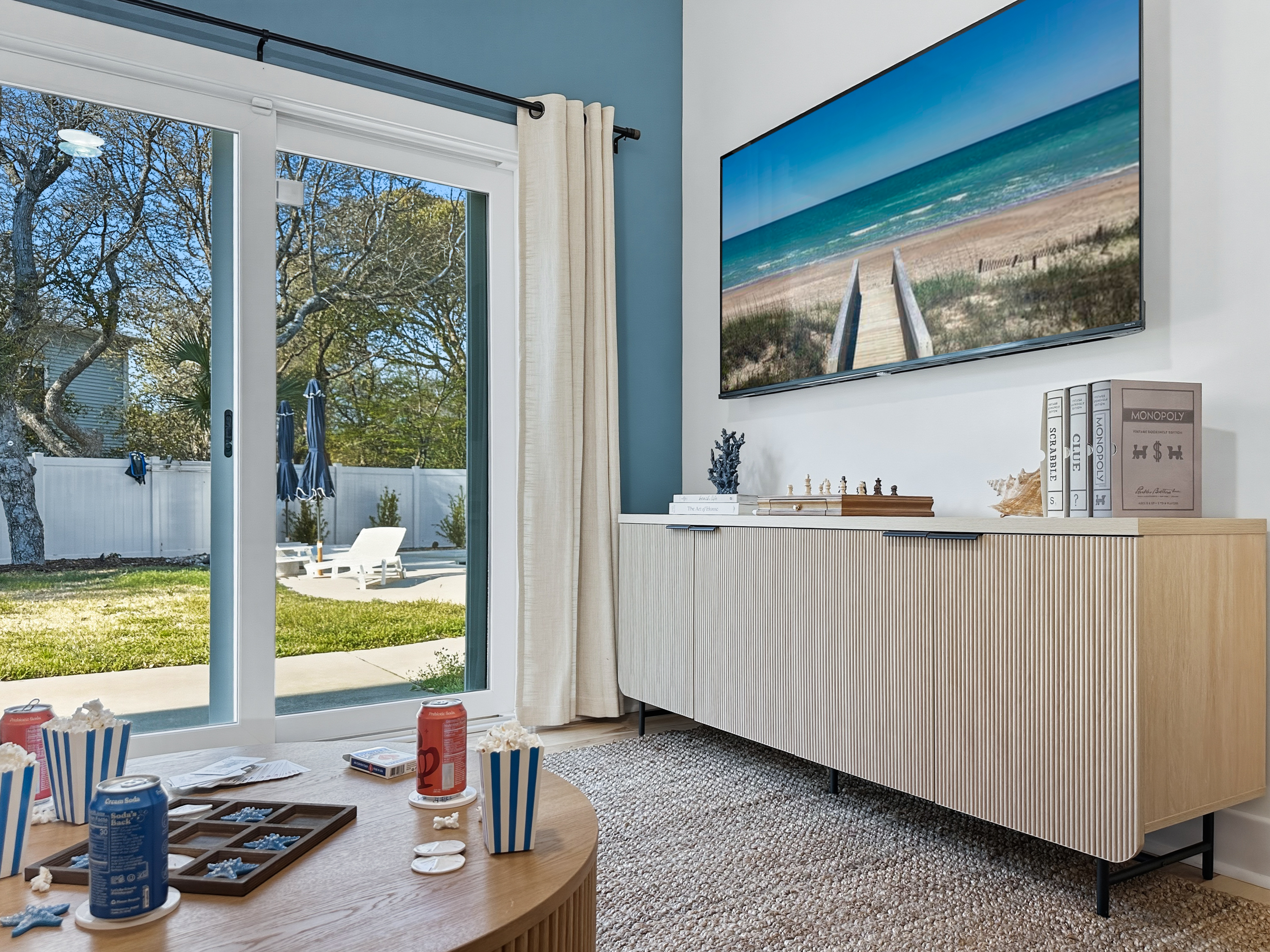 The sliding glass doors lead you to the backyard.