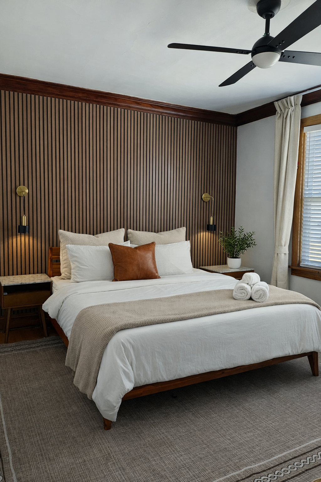 Comfort-focused bedroom designed for great sleep—premium linens, blackout. curtains, and a peaceful atmosphere.