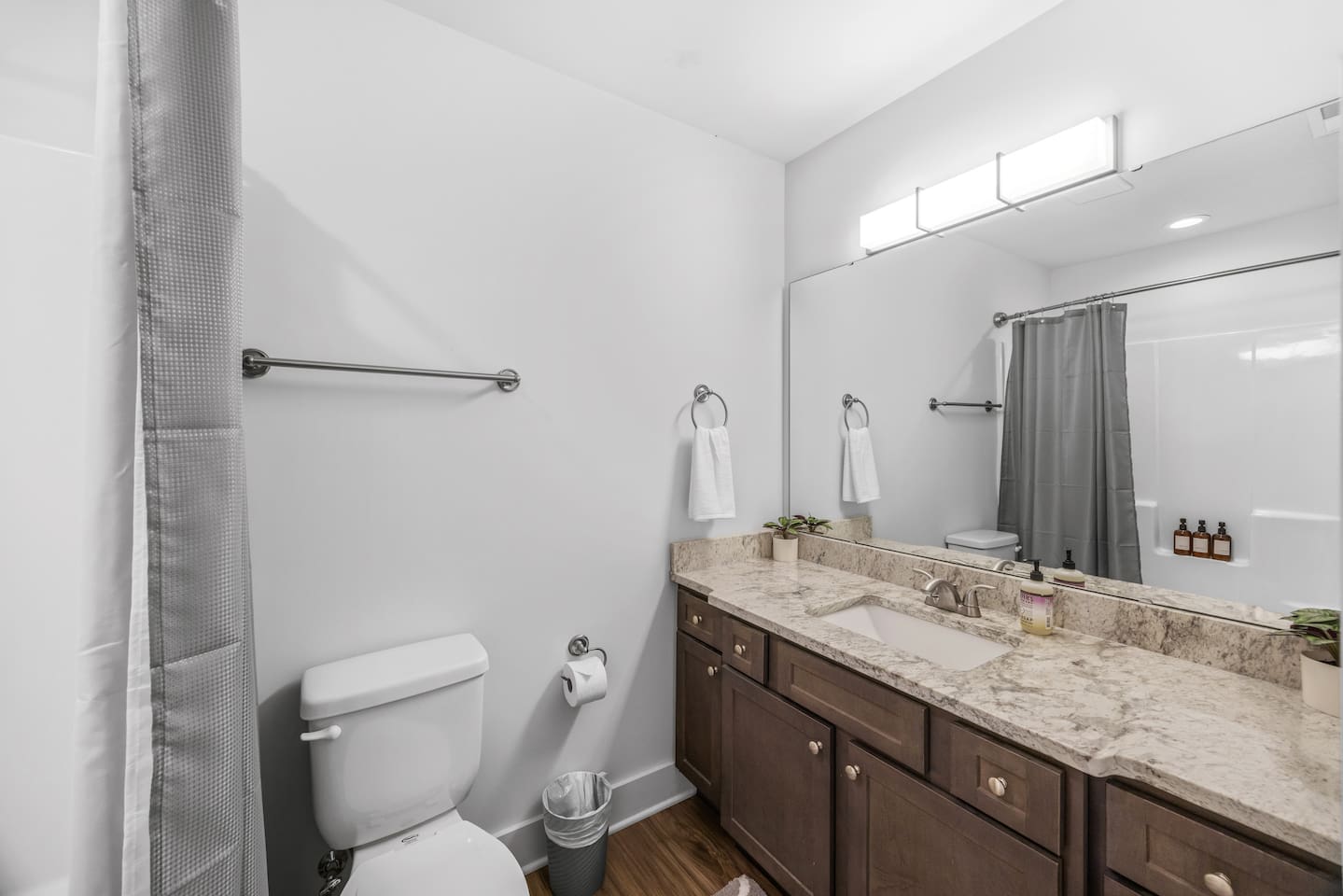 Features a granite vanity, shower/tub combo, and fresh modern design for added comfort and convenience.