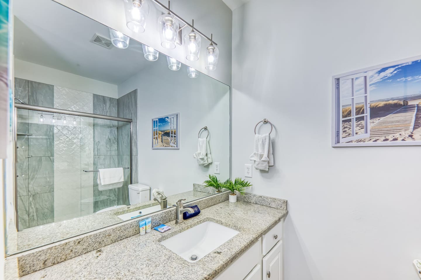 Bathroom Bliss: Bright, modern space with stunning finishes and beachy decor! Shine after every adventure!